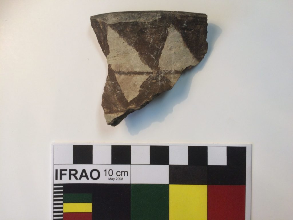 A rim fragment of an ancestral Piipaash black-on-buff jar found at a protohistoric residential site along the lower Gila River.