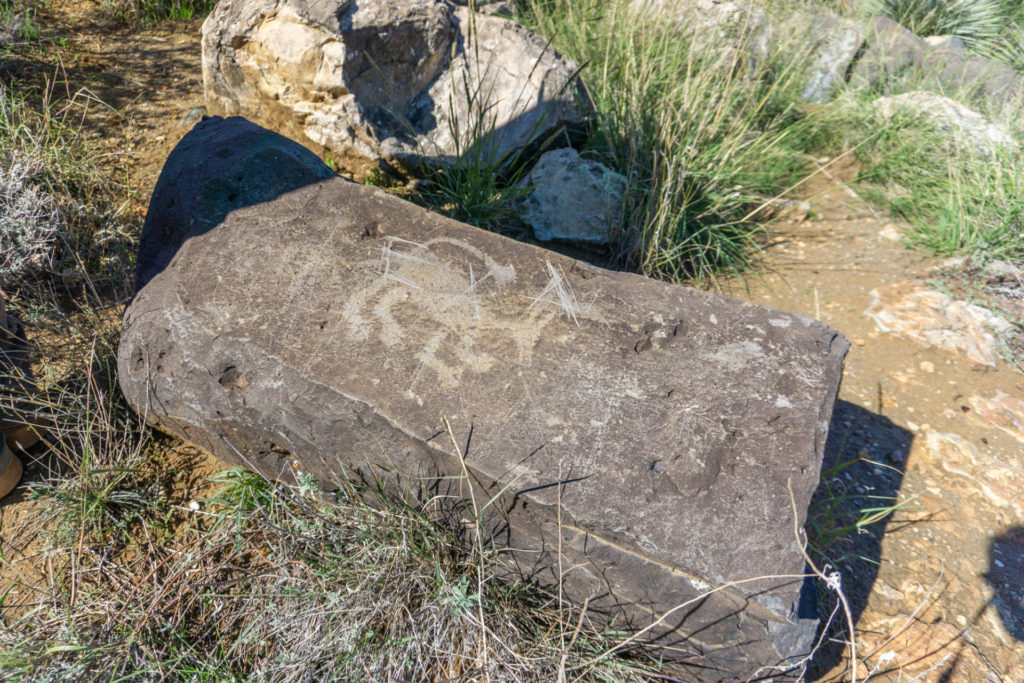 Graffiti marks on a petroglyph boulder in a well-traveled area. Image: Kathleen Bader