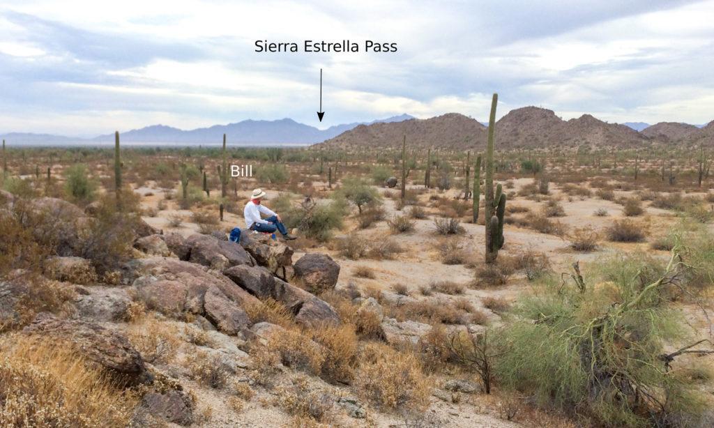 View from the trail across the Rainbow Valley and at the pass in the Estrella Mountains.