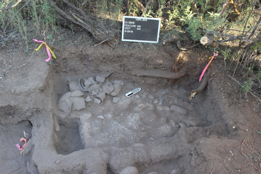 This room at the southeast corner of the northern room block had a mealing bin (or grinding station). The rim of a bowl set into the floor of the room can be seen at the center right of the photo. The sherds in the corner represent at least two reconstructable jars.