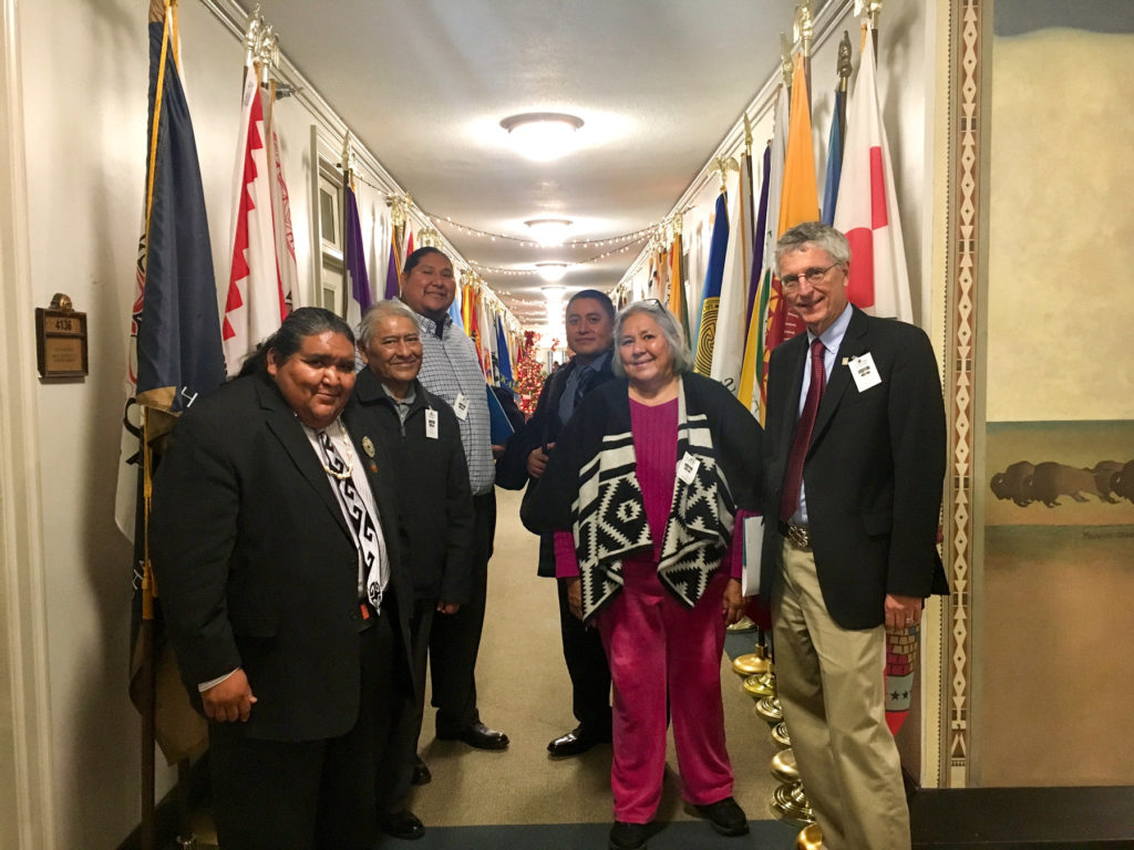 At the Department of Interior hall of flags. From left to right: Verlon Jose, Barnaby Lewis, Albert Nelson, Alvin Antone, Gloria McGee, Bill Doelle. Image: Janelle DiLuccia