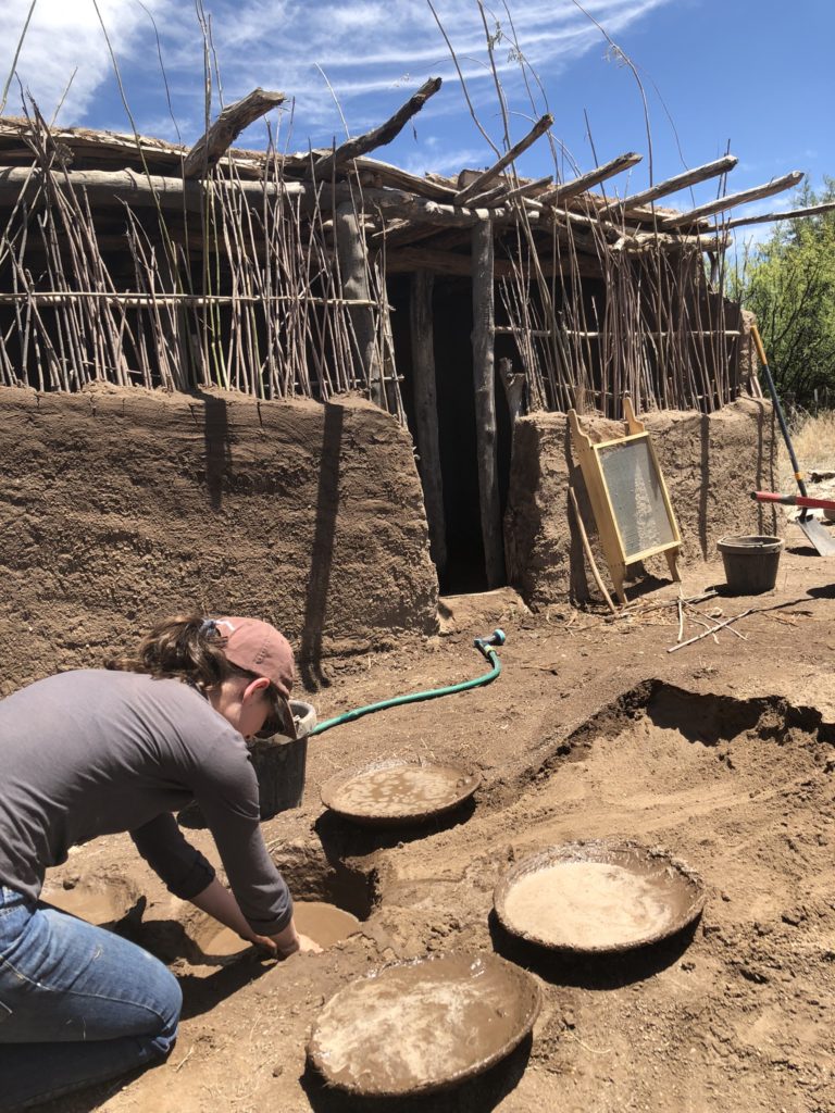 The process of mixing mud for the adobe structure. Image: Kristin Bridges