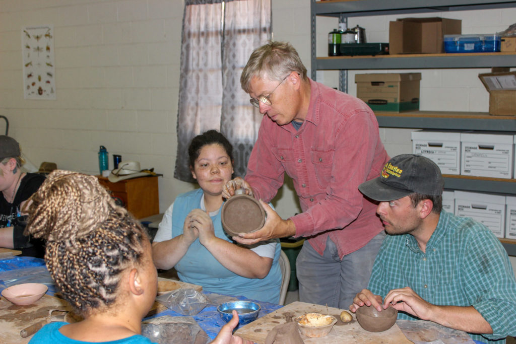 Andy Ward helps Kat, Sam, and London with their pots in progress.