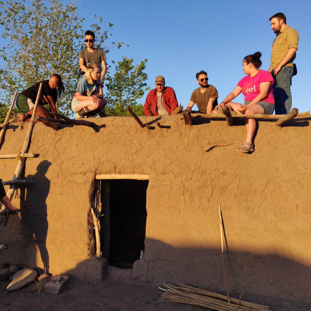 On top of the replica adobe room block with Allen. From left to right: London Booker, Ruijie Yao, Gabby Pfleger, Allen Denoyer, Taylor Cole, Beatriz Barraclough-Tan, and Lewis Dolmas. Image: Ray Mills