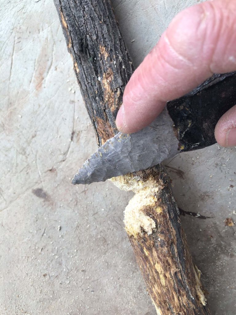 Sawing with stone knife.