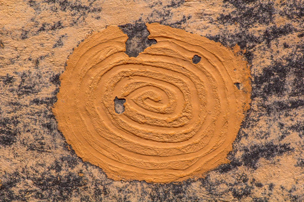 This clay spiral is one of two attached to a sooted wall of an Ancestral Puebloan structure. © Jonathan Bailey