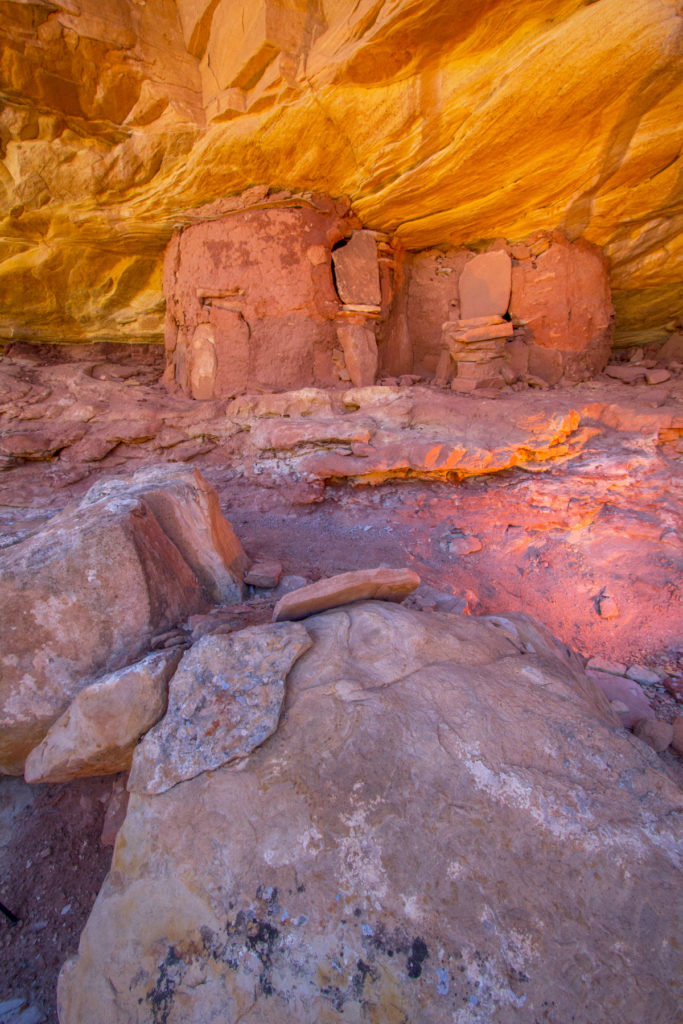 Slabs of sandstone block entry to these structures. At one point in time, these slabs would have been sealed to the structure. Through use, erosion, and irresponsible visitors separating them from the structure to look inside, the slabs are no longer attached. © Jonathan Bailey