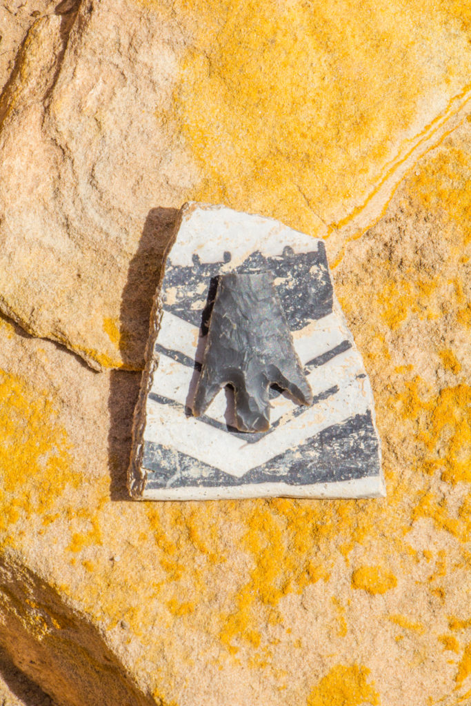This Abajo stemmed projectile point was left on a Cortez black-on-white ceramic, likely by a present-day visitor. Tangible artifacts not only give us priceless insights into the past, but they are also deeply tied to the places in which they remain. It is critically important to leave them where they were found. © Jonathan Bailey