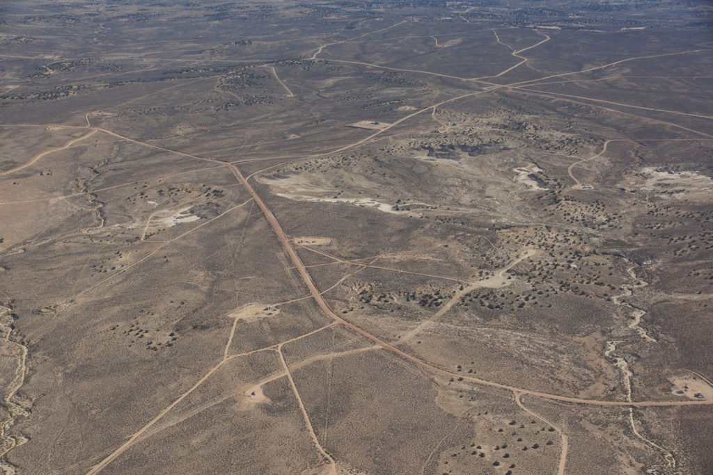 Landscape criss-crossed with roads, well pads