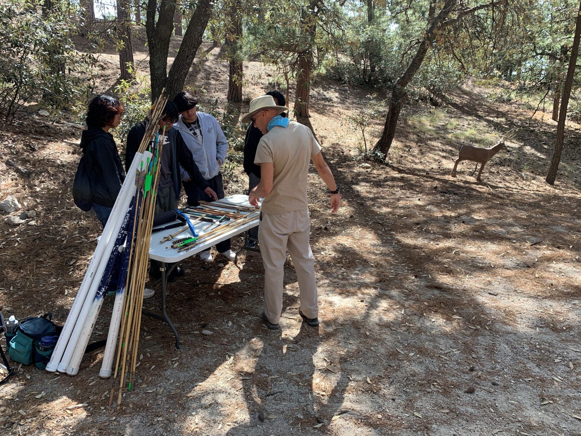 Volunteer Rocky shares atlatl skills with students in the Bryan Brown Youth Academy.