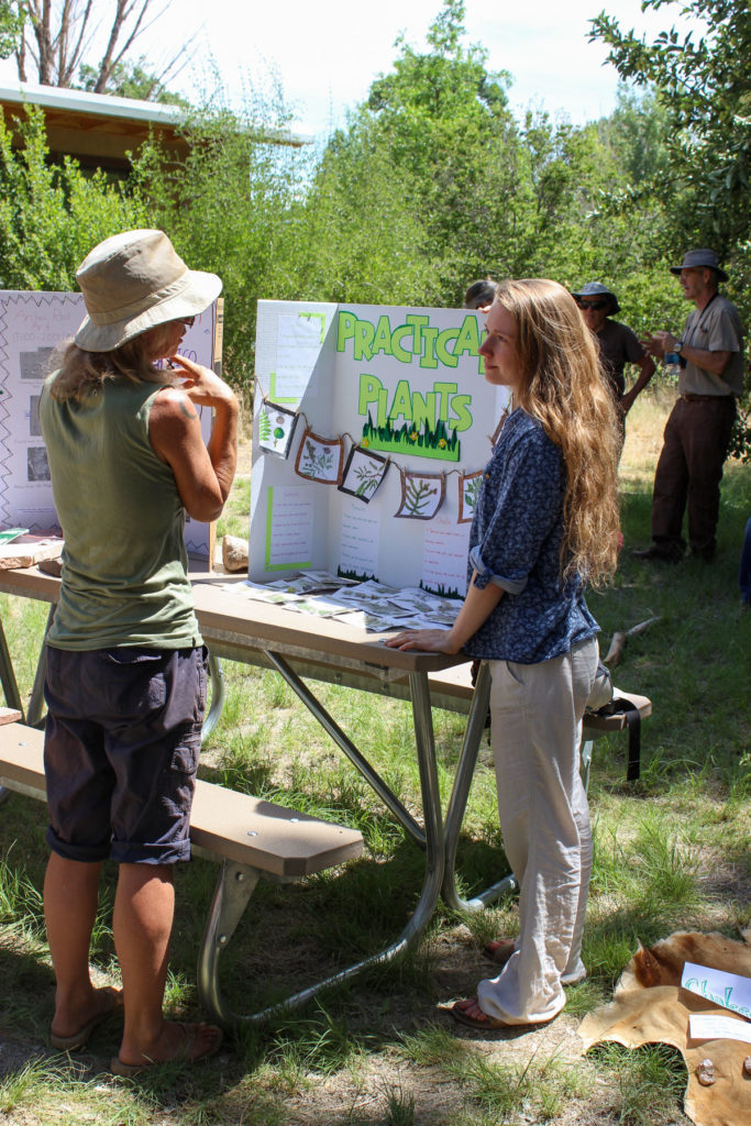 Field school student Kiley Stoj in a discussion about the traditional uses of local plants.