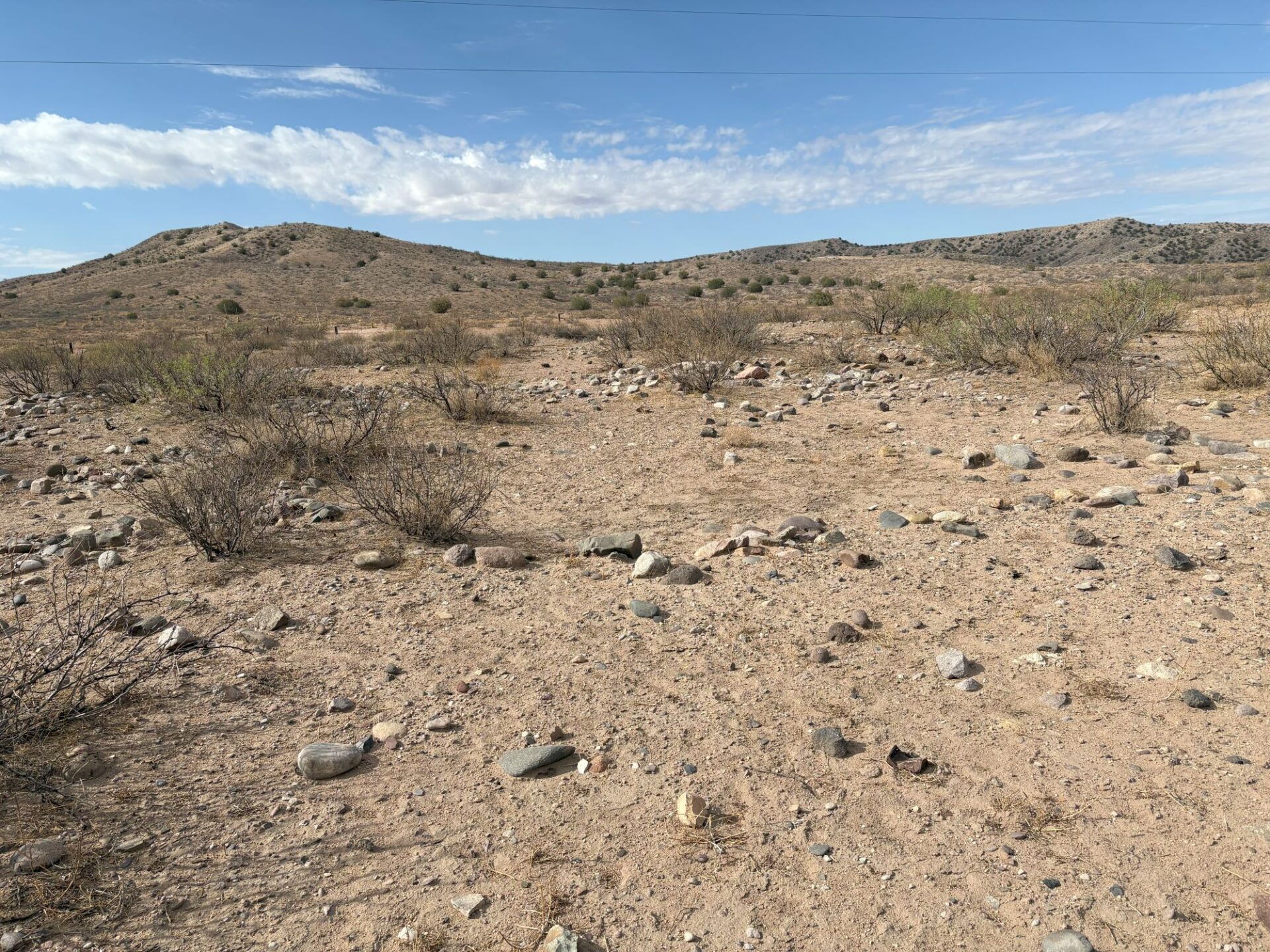 Surface rock alignments allowed us to discern the locations of Classic Mimbres Period pueblo room walls.