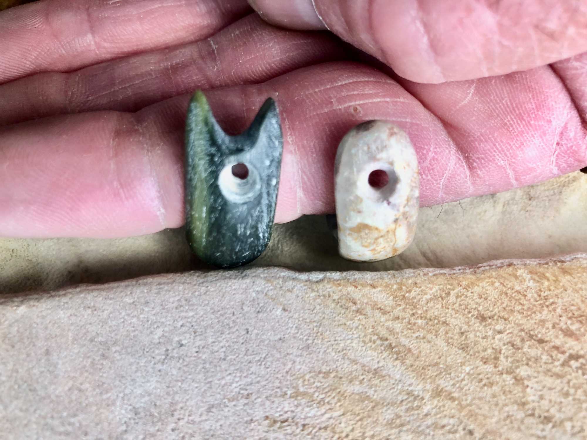 This shows the two styles of stone atlatl loops found in Sonora, northwest Mexico. Both are replicas. The notched example at left is known as “Sonoran style.” This style is known from the La Playa site and from an example found in Soyopa, Sonora. The two stone loops found in the Tucson Basin represent each style.