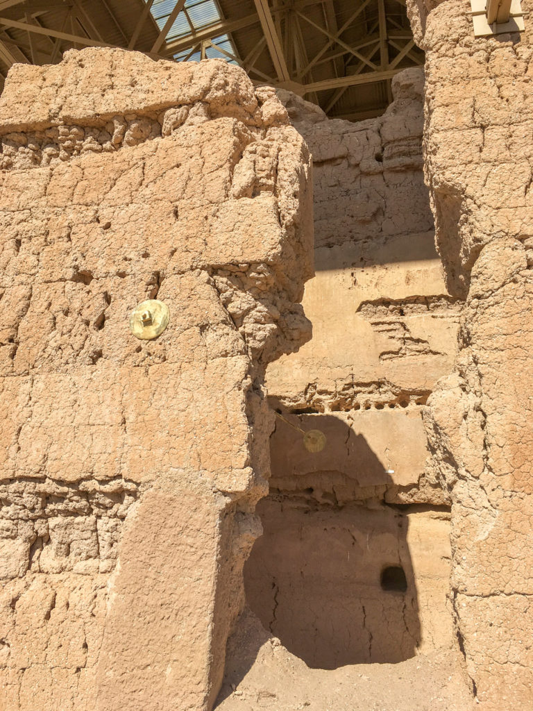 Construction seams visible in the adobe great house.
