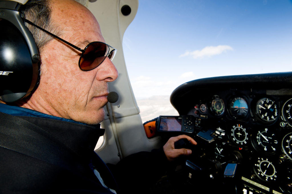 Bruce Gordon, aviator extraordinaire and President of EcoFlight, at the controls. Image: Jane Pargiter.