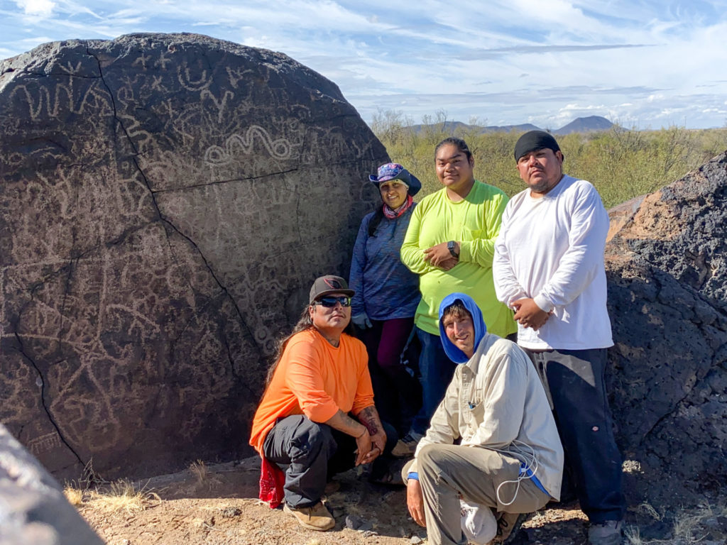 Standing (left to right): Keahna Owl, Zion White, Charles Arrow; Kneeling (left to right): Jason Andrews, Aaron Wright. This photo is from 2019. Team members will be working from home on the new project.