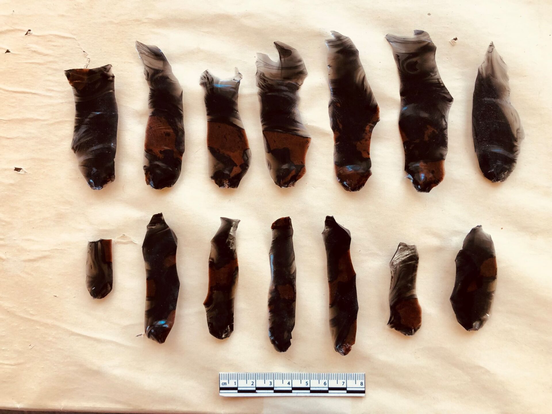 Here are the obsidian blades typical of macuahuitls. They were made through the flintknapping technique of indirect percussion, then snapped or flaked into rectangular segments.