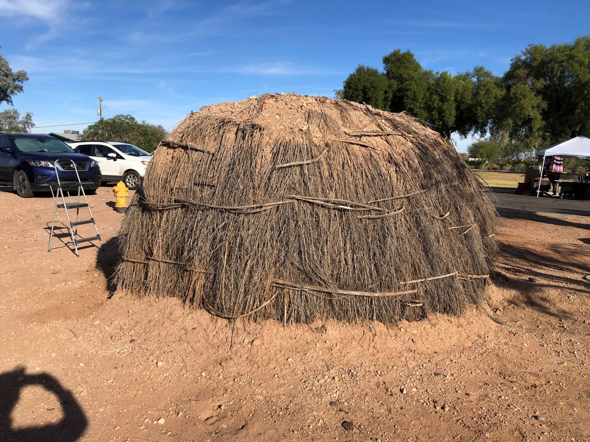 A replica O'odham pithouse made of plant materials and adobe.