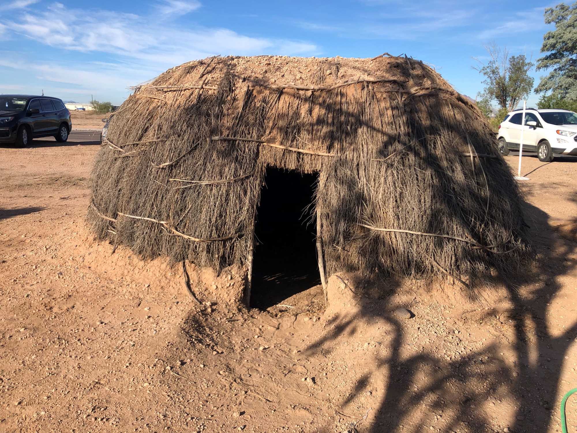 A replica O'odham pithouse made of plant materials and adobe.