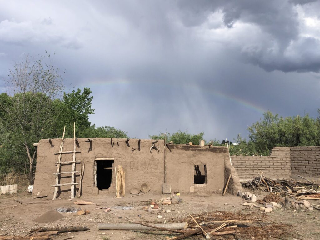 This is a two-room puddled adobe structure we built at our former camp headquarters in Cliff, New Mexico. The adobe brick wall to the right is contemporary.