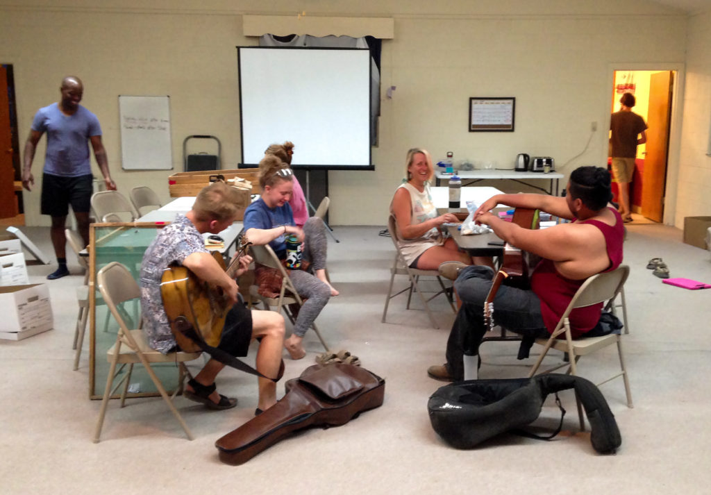 Field school students take an evening break with music in our lab space.